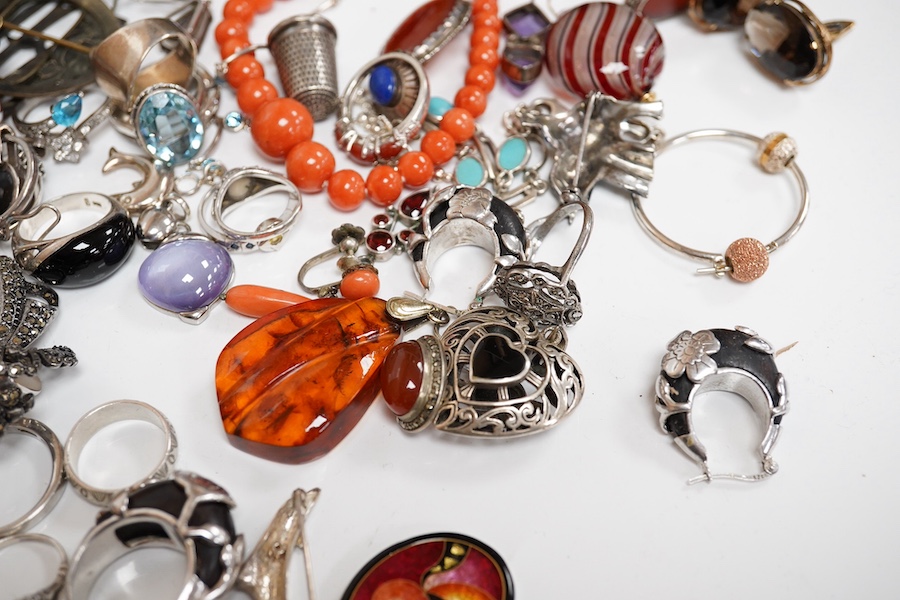 A quantity of assorted silver and costume jewellery including a Georg Jensen style brooch, a graduated coral bead necklace, 56cm, gross weight 35 grams, pair of coral drop earrings, a George V silver combination latter o